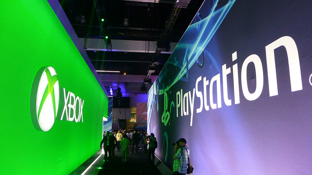 The PlayStation and Xbox booths at E3 2013
